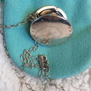 Tiffany & Co. necklace with round locket pendant.